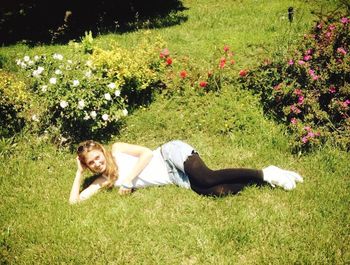 Man sitting on grassy field in park