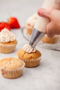 Close-up of hand holding cake