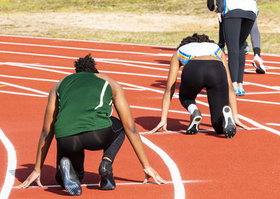 Rear view of men running