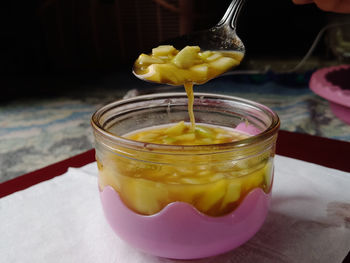 Close-up of drink in glass jar on table
