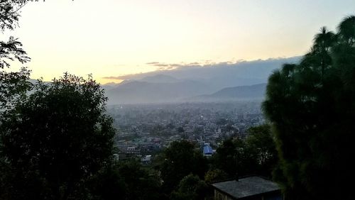 Scenic view of landscape against sky at sunset