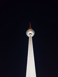 Low angle view of communications tower against sky