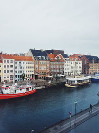 Boats moored at harbor
