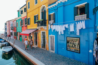 Buildings by street in city