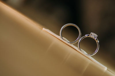 High angle view of wedding rings on table