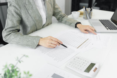 Confidence woman concept, businesswoman is checking information to analyzing business strategy.