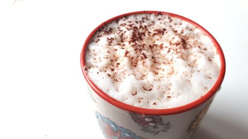 Close-up of coffee cup against white background