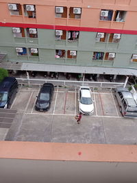 High angle view of parking lot by building