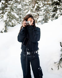 Female photographer gets the shot in snowy british columbia.