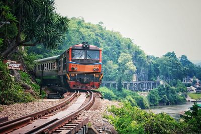 Train on railroad track against sky