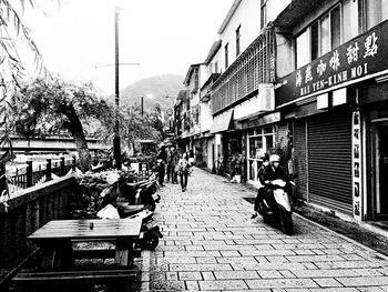 People walking on road in city