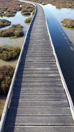 Boardwalk leading to calm lake