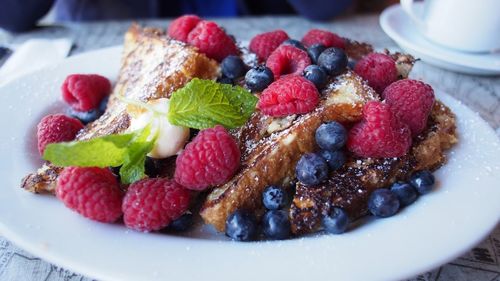 Cake slices with fruit on plate