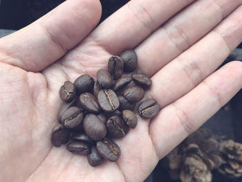 High angle view of hand holding coffee