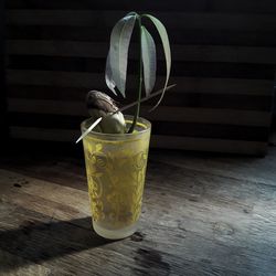 Close-up of drink in vase on table