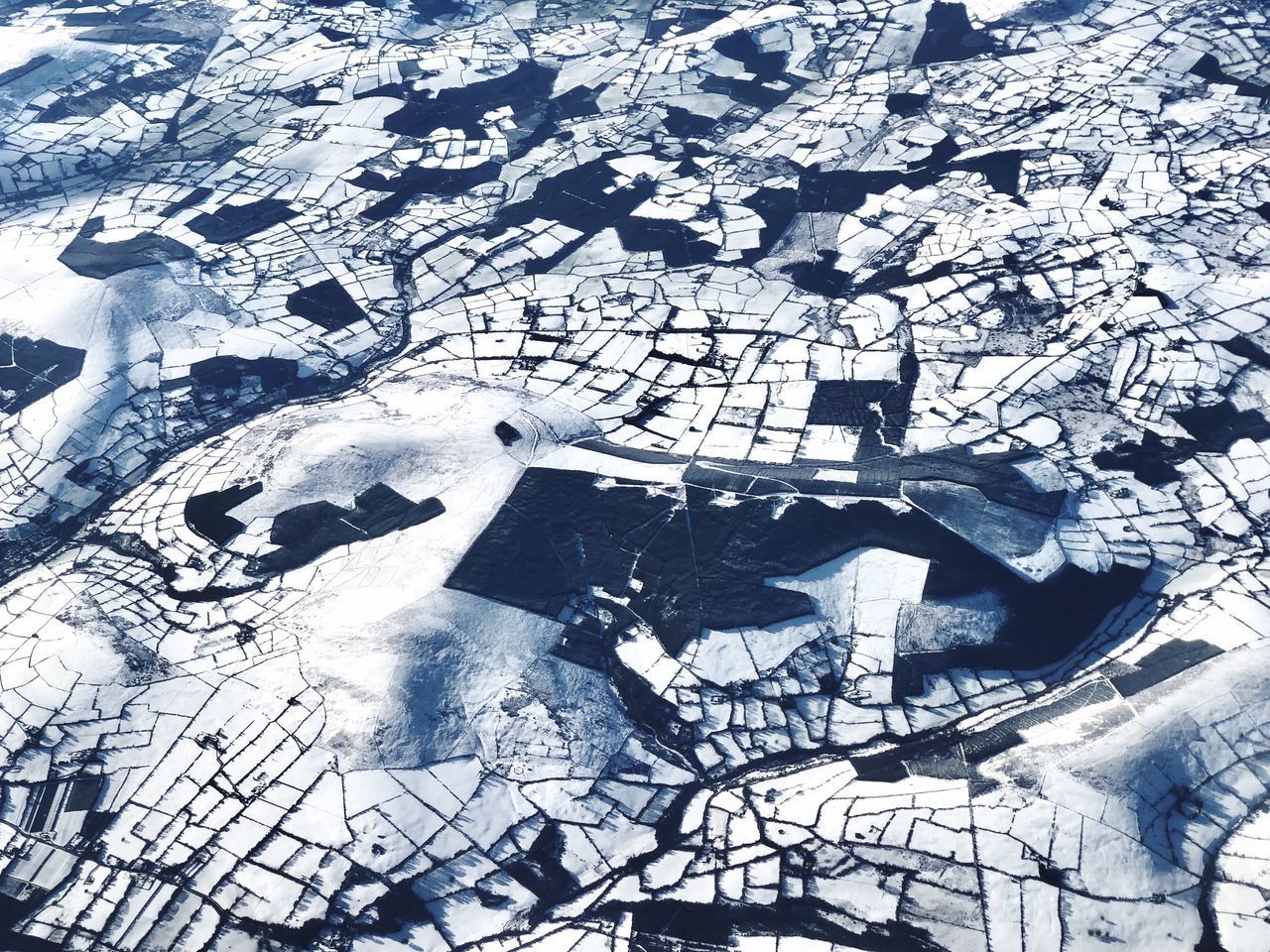 HIGH ANGLE VIEW OF SNOW ON FIELD