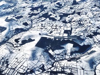 High angle view of snow on field in city