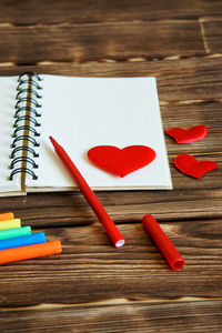 High angle view of red heart shape on table