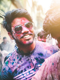 Portrait of smiling young man wearing sunglasses