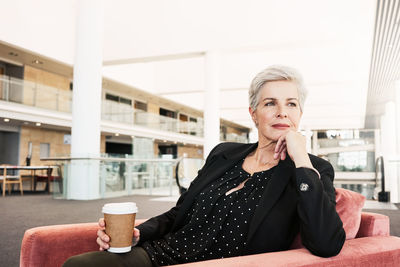 Portrait of woman drinking coffee