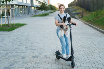 Low section of woman walking on street