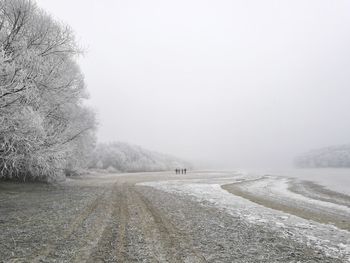 Scenic view of snow covered landscape against clear sky