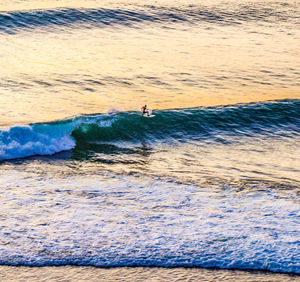 People on beach by sea