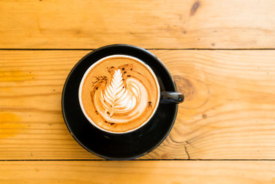High angle view of cappuccino on table
