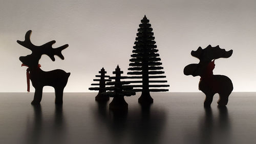 Silhouette of people on wall