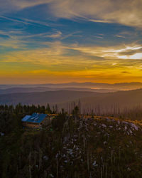 Scenic view of landscape against sky during sunrise