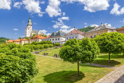 Buildings in town against sky