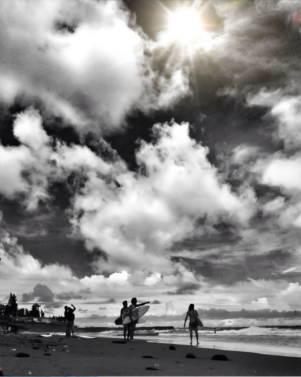 sky, cloud - sky, lifestyles, beach, men, leisure activity, silhouette, sunlight, sea, togetherness, walking, cloudy, full length, cloud, person, sun, nature, sunbeam