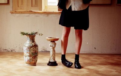 Low section of woman standing on floor