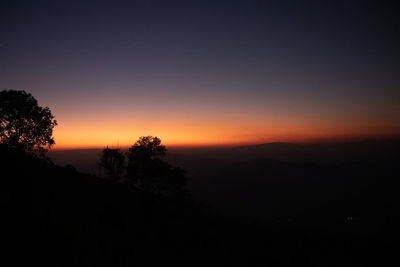 Scenic view of silhouette landscape against clear sky at sunset