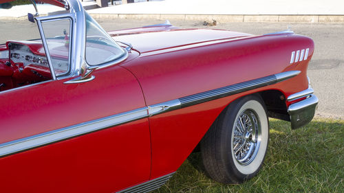 Red vintage car on street