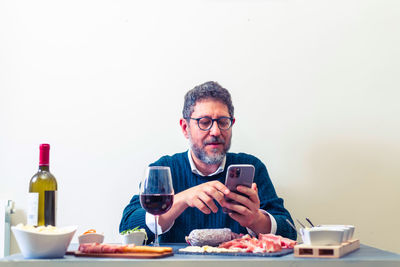 Mid adult man using laptop on table