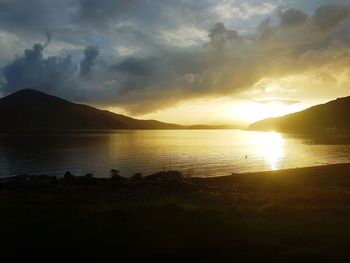 Scenic view of lake against sky during sunset