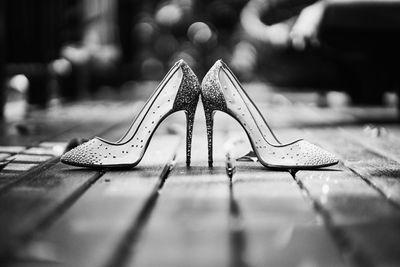 Surface level view of high heels on footpath
