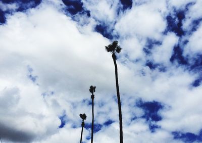 Low angle view of street light against cloudy sky