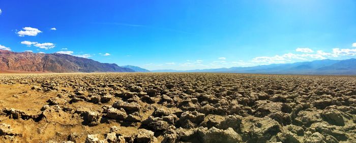 Scenic view of landscape against blue sky