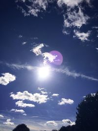 Low angle view of moon against blue sky