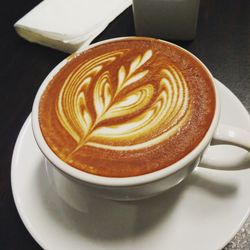 High angle view of cappuccino on table