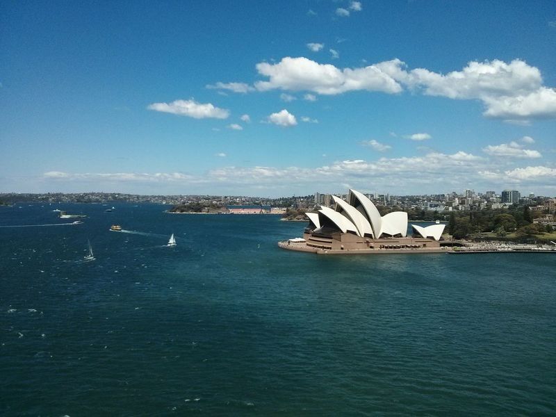 The Sydney Opera House from afar. · sydney Opéra building Architecture pseudo-aerial sunny day clouds and sky Yeah