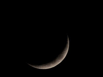 Low angle view of moon against sky at night