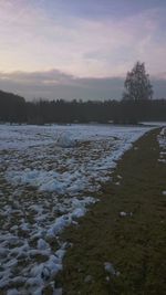 Scenic view of frozen lake against sky during winter