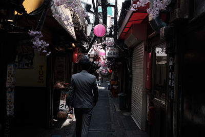 Rear view of woman standing in store