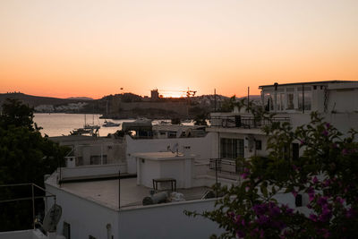 High angle view of buildings against sky during sunset