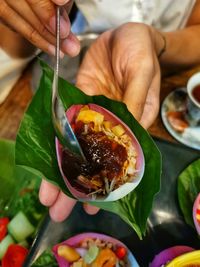 Close-up of hand holding food