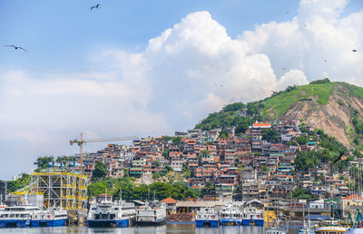 Buildings in town against sky