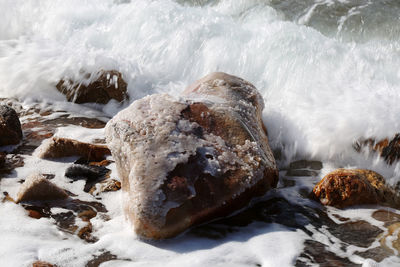 Rocks in sea during winter